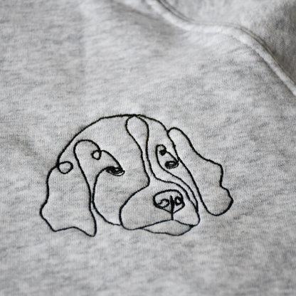 Sweater met lijntekening hond geborduurd